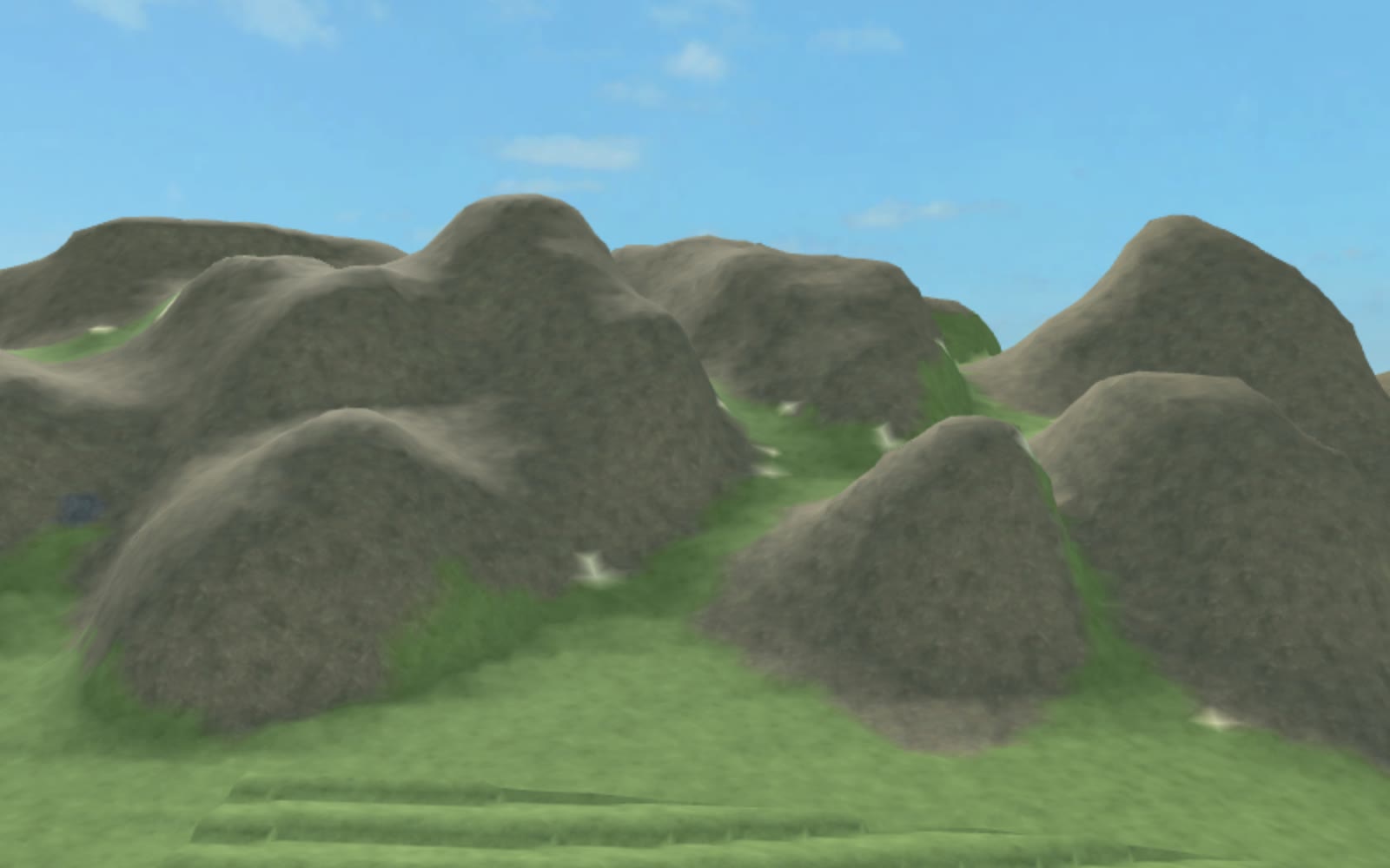 Wide landscape view of rounded mountain chains and terraced grassland across Japanese-inspired Roblox terrain